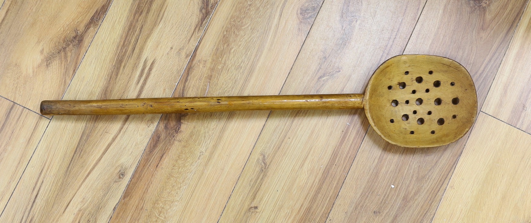 A 19th century beech jam spoon, 71cm